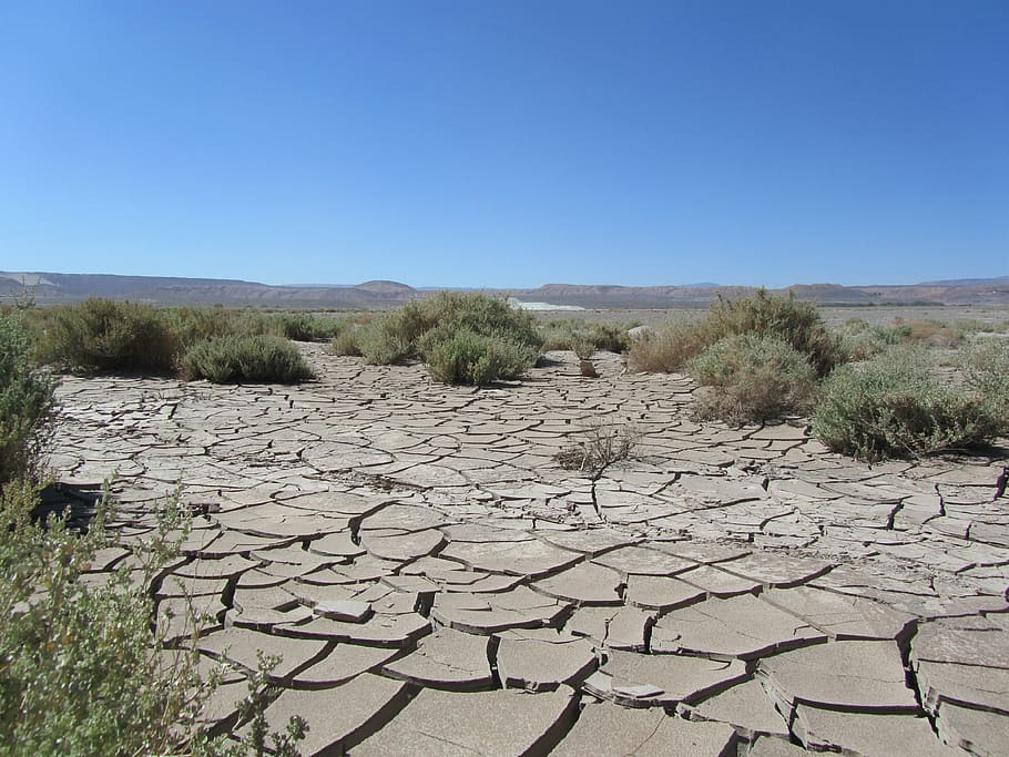 cracked soil in the middle of the field, atacama, desert, sky