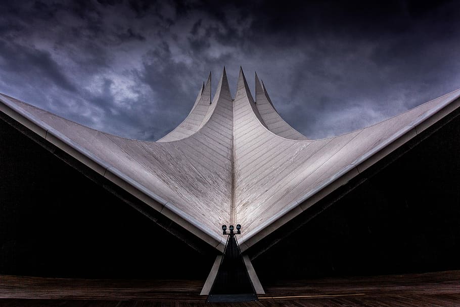 portrait of  white structure under the dark sky during day time HD wallpaper