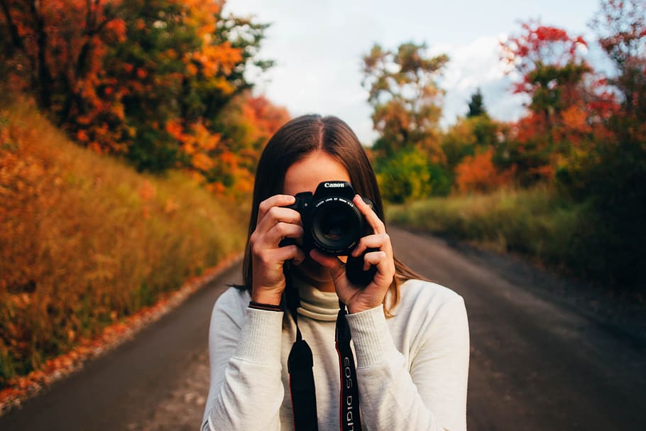 photo of woman holding camera, canon, girl, lens, person, taking photo