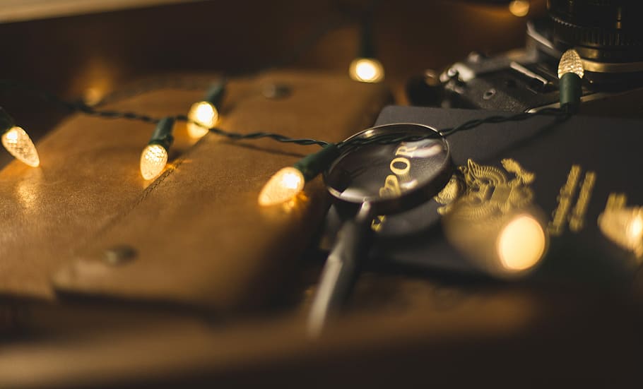 photo of yellow string lights, black magnifier glass, fairy light HD wallpaper