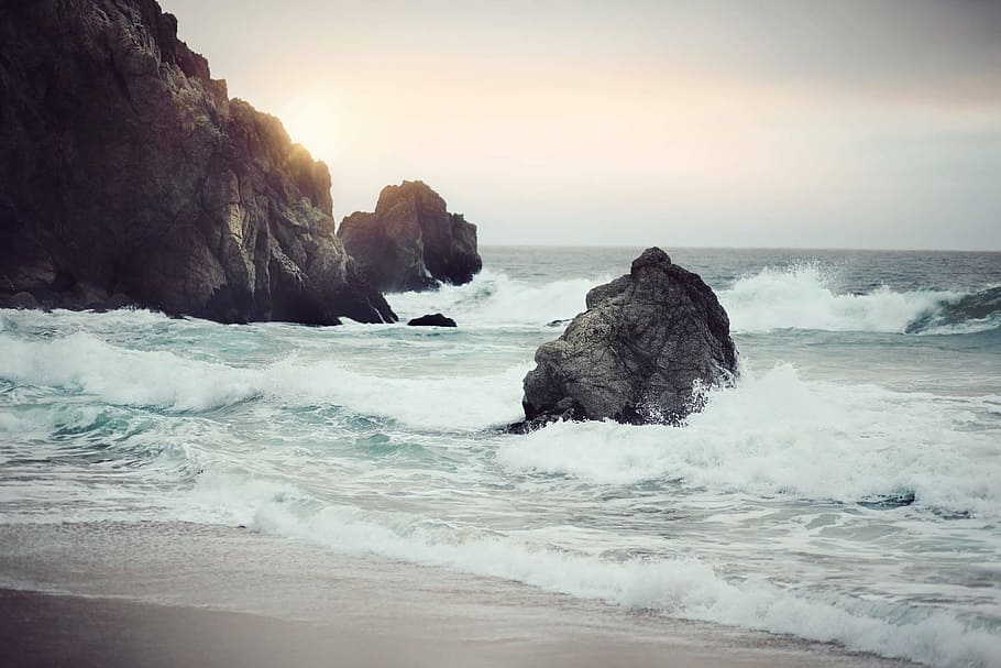 landscape photography of waving body of water and island, crashing HD wallpaper