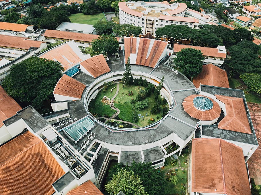 aerial view of park in city during daytime, high-angle photography of round concrete building, HD wallpaper