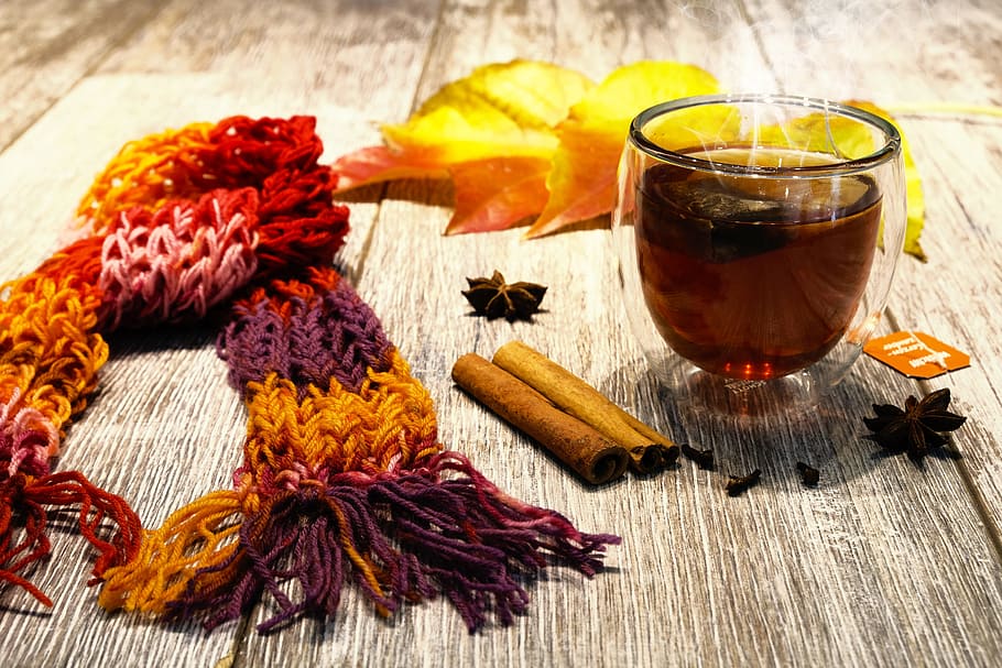knitted scarf beside dried leaf and shot glass on wooden surface, HD wallpaper