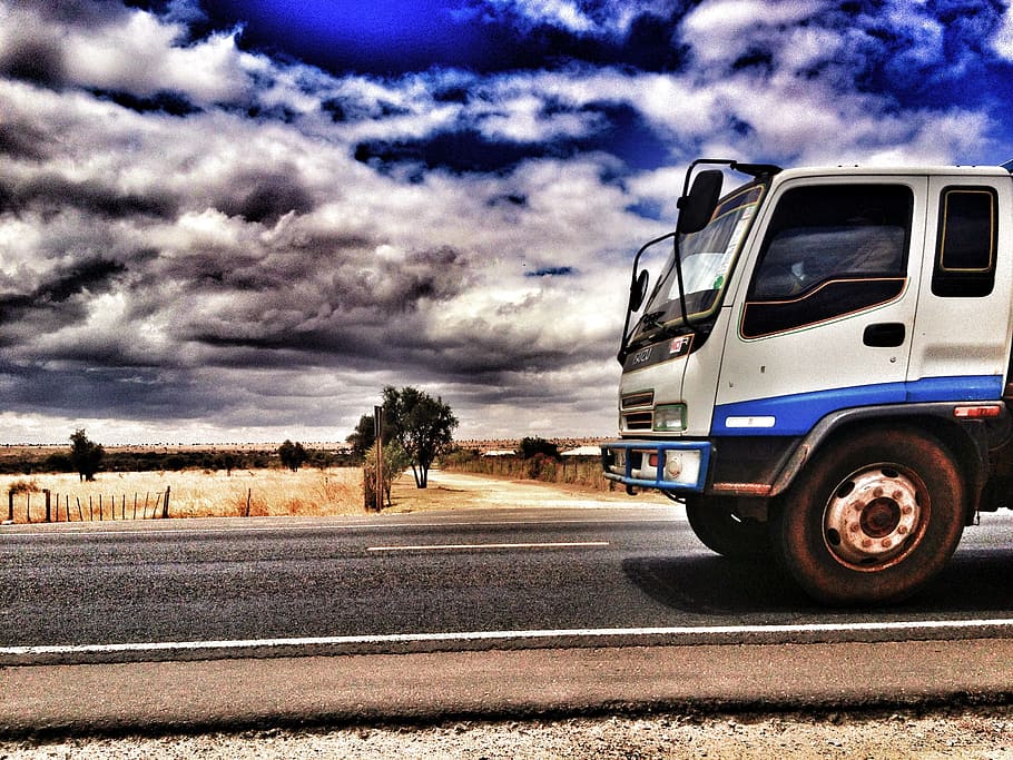 photo of a white and blue truck on the road near wheat fields during daytime, HD wallpaper