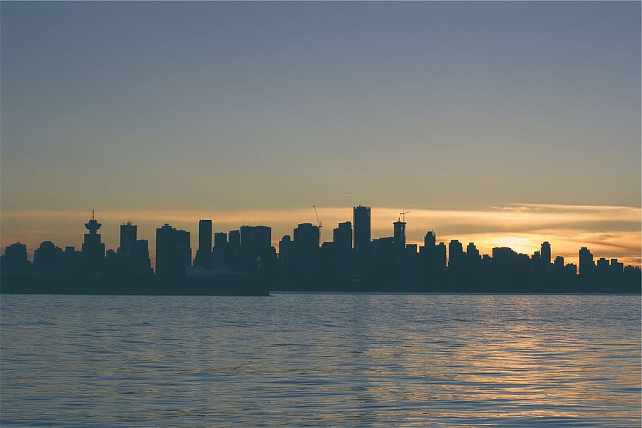 sunset, dusk, skyline, lake, water, buildings, towers, high rises HD wallpaper