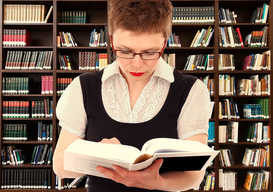 woman reading a book with books in the background, person, head, HD wallpaper