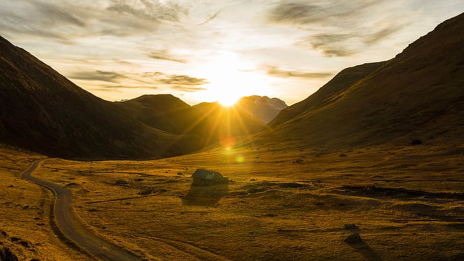 high angled photography of field, sun rising behind mountains HD wallpaper