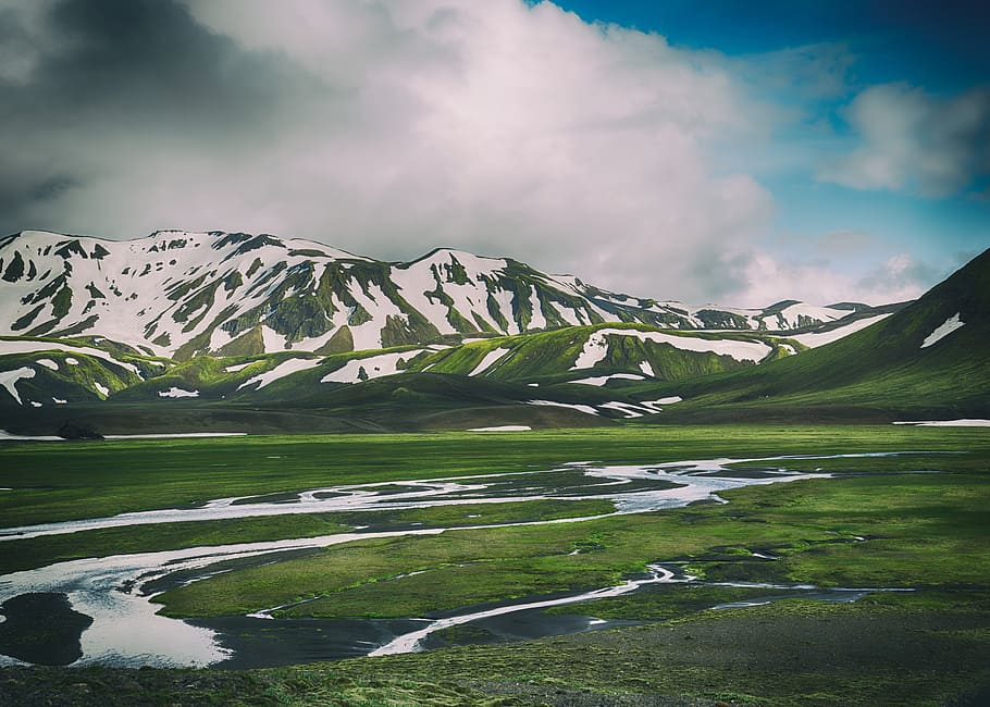 landscape photo of green and white mountains, green mountains covering snow under blue sky during day time HD wallpaper
