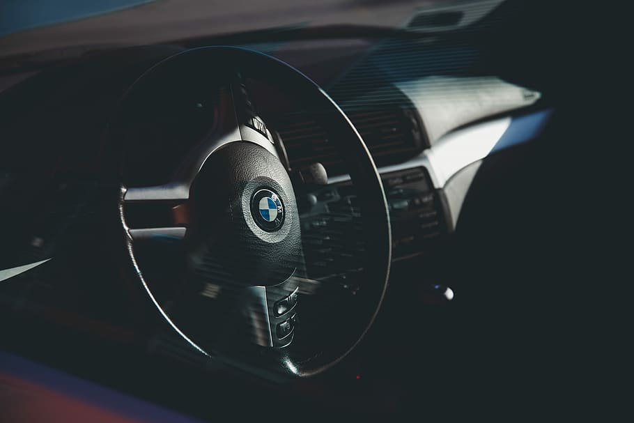 person inside BMW car, steering wheel, dashboard, controls HD wallpaper