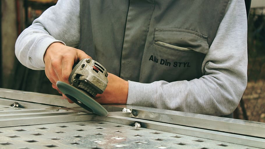 man holding gray cordless angle grinder, tools, worker, machine HD wallpaper