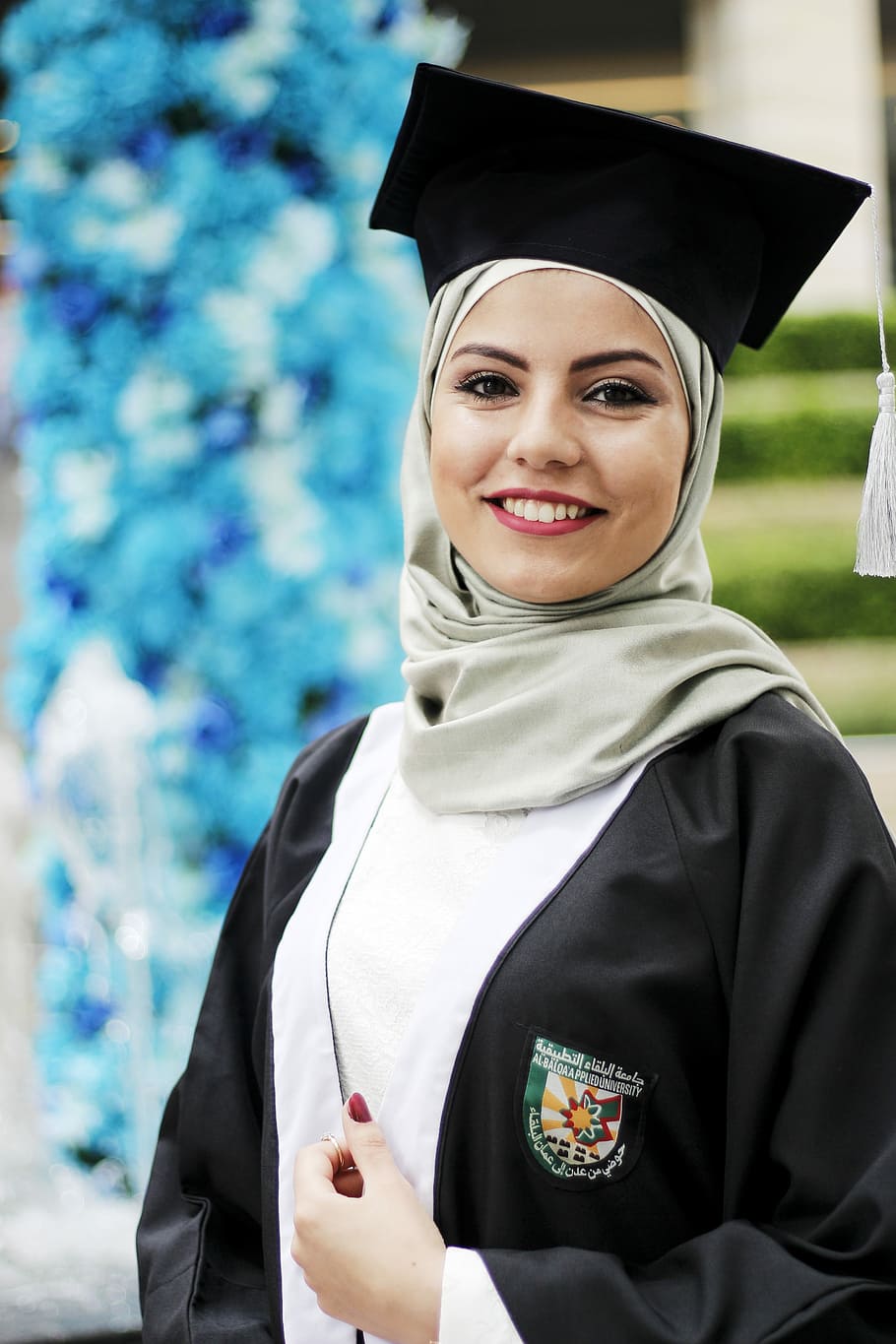 woman wearing black academic dress, graduates, celebration, graduation