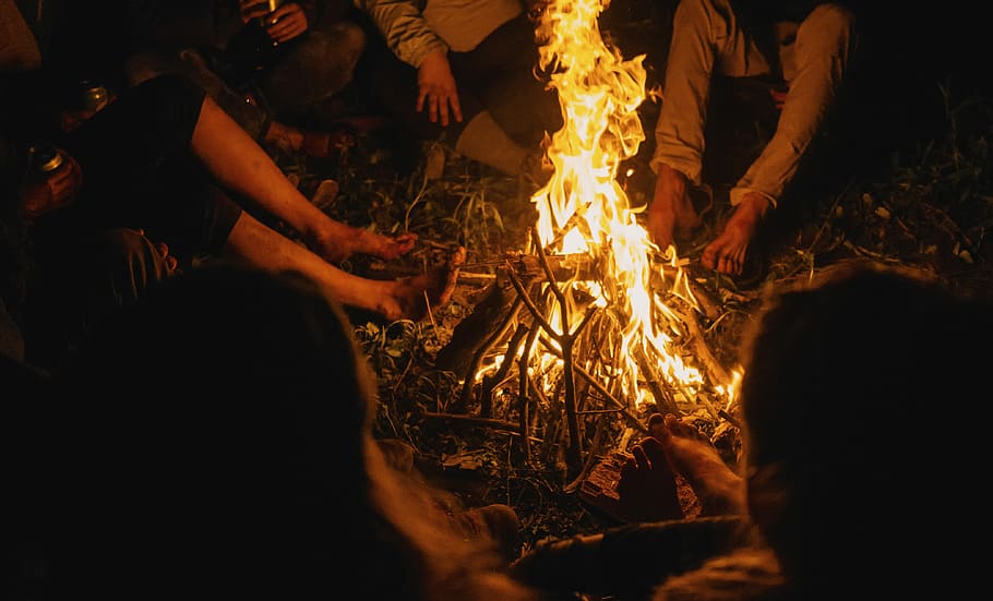 lighted bonfire, people gathering within bonfire, wood, camp fire