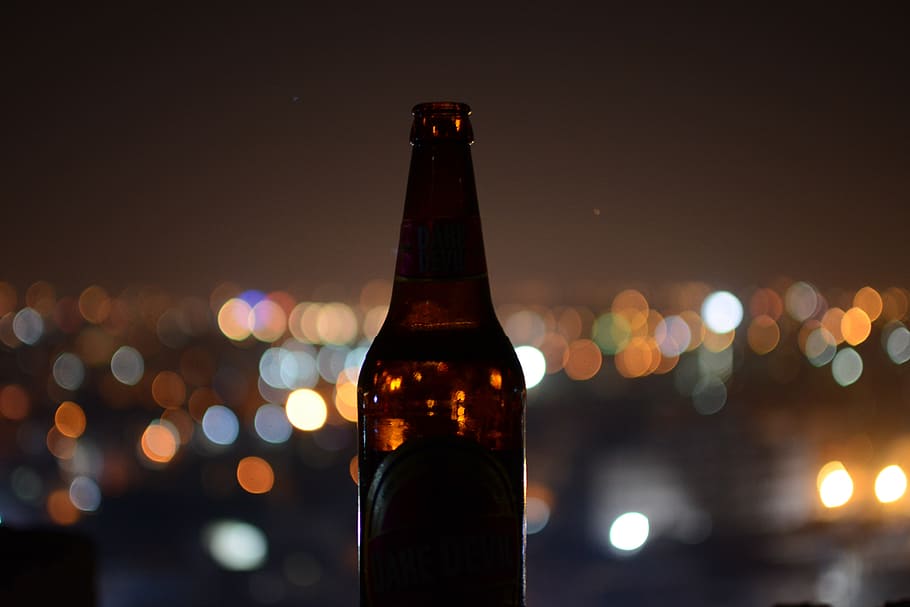 shallow focus photo of brown glass bottle, amber glass bottle HD wallpaper