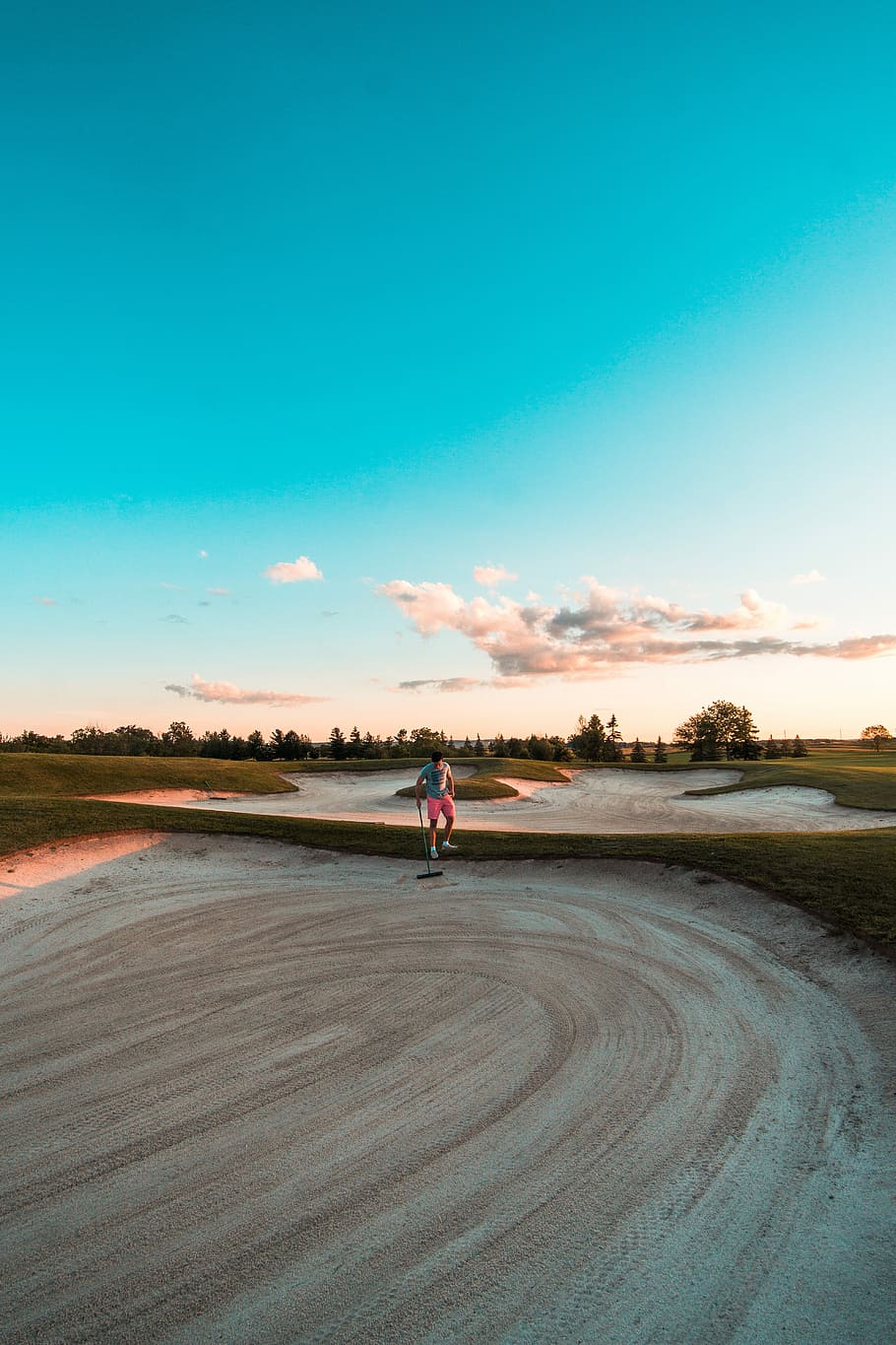 man standing on ground while holding broom, person standing on golf course HD wallpaper