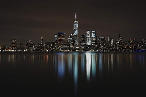 landscape photo of city building during night, panoramic photography of city buildings at nighttime HD wallpaper
