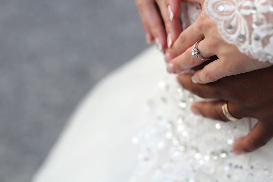 people holding hands while wearing gold-colored wedding rings, man wearing gold-colored ring and woman wearing silver-colored ring HD wallpaper