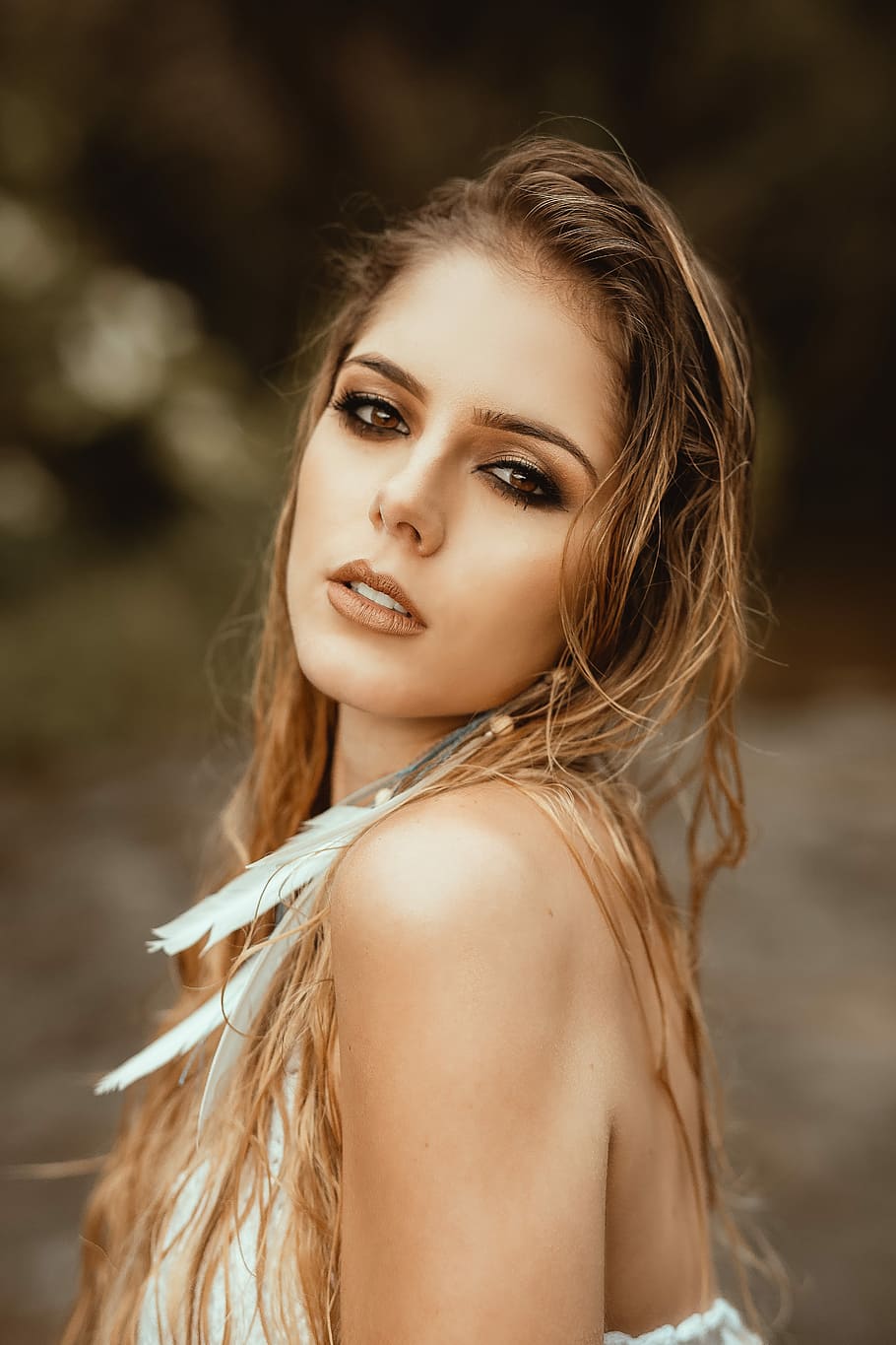 focus photography of blonde woman with feather earring, woman with white sleeveless tops and blonde hair at daytime HD wallpaper