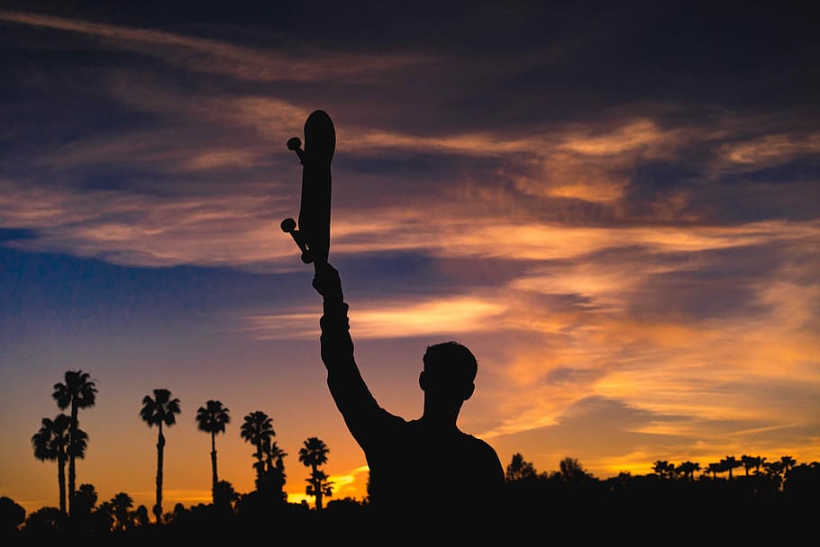 silhouette of man holding skateboard, silhouette of person holding up skateboard HD wallpaper