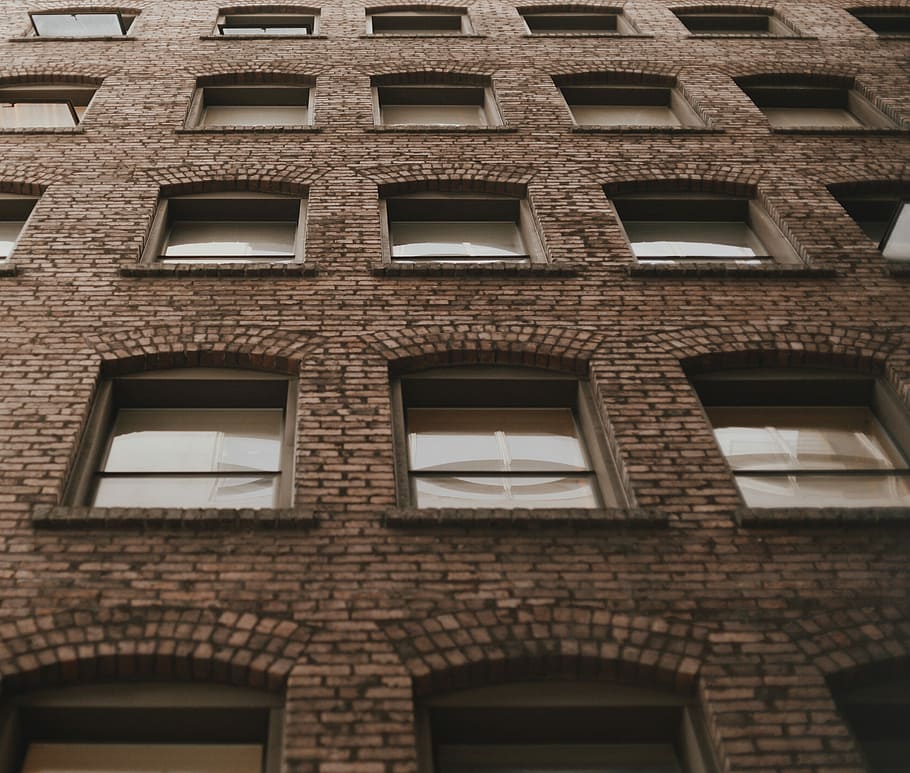 low angle photo of brown building, low-angle photography of brick wall building HD wallpaper