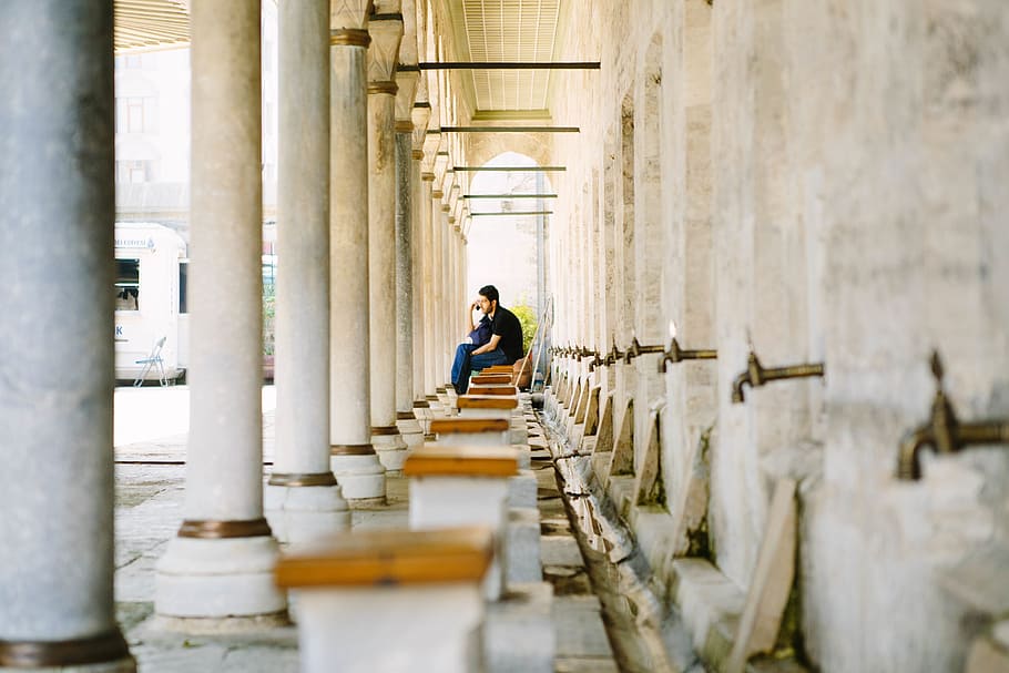 people, man, alone, sitting, waiting, building, structure, post HD wallpaper
