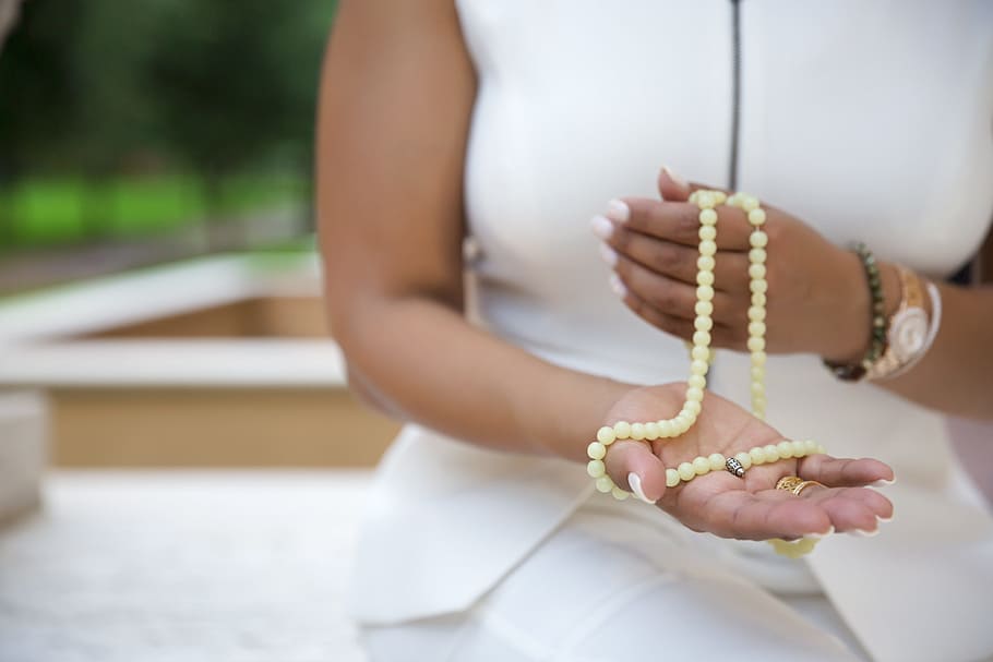 woman holding white misbaha prayer beads, people, adult, meditation, HD wallpaper