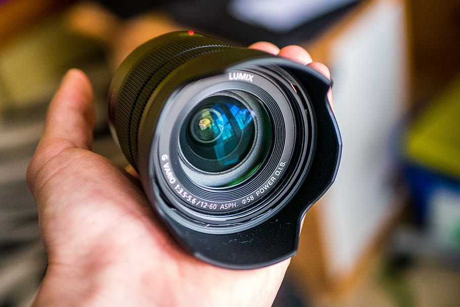 closeup photo of black Lumix camera lens, hand, hold, holding HD wallpaper