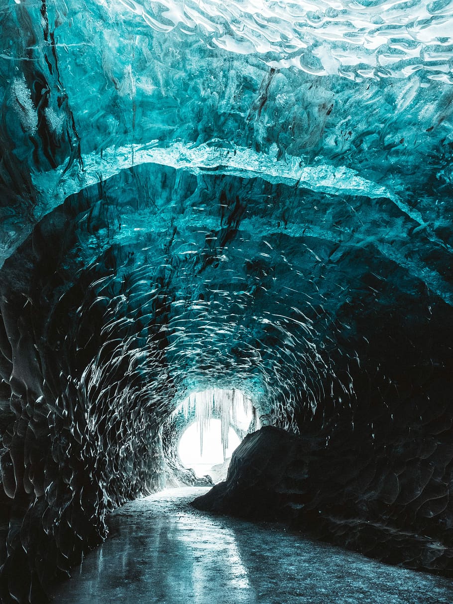 ice tunnel with narrow pathway, cave surrounded body of water HD wallpaper