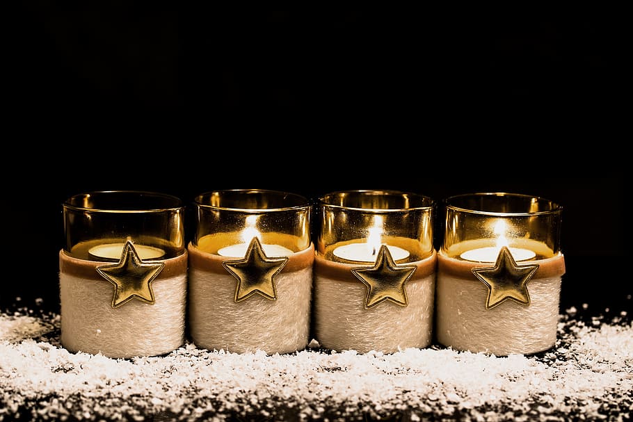 four clear votive candles inlined on gray surface, third advent HD wallpaper