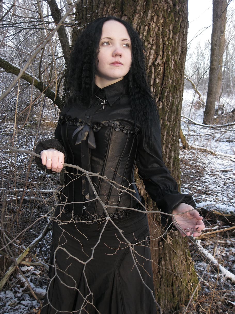 woman in black Victorian era dress near brown tree, model, female