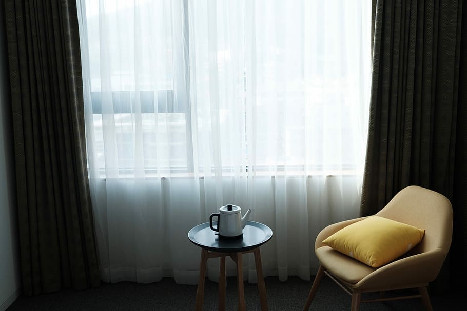 beige armchair, white ceramic pitcher beside yellow leather chair HD wallpaper