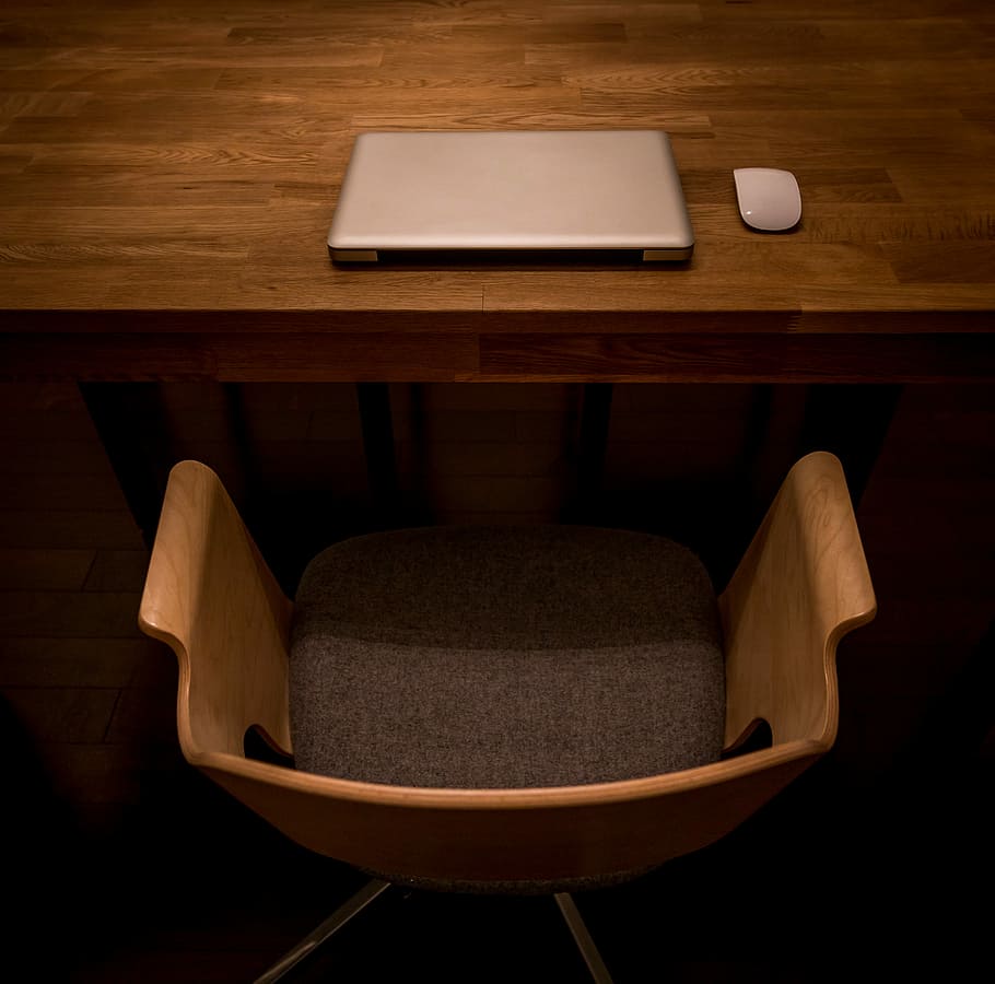 Laptop Work Space with a Wooden Chair, brown swivel armchair in front of silver laptop HD wallpaper
