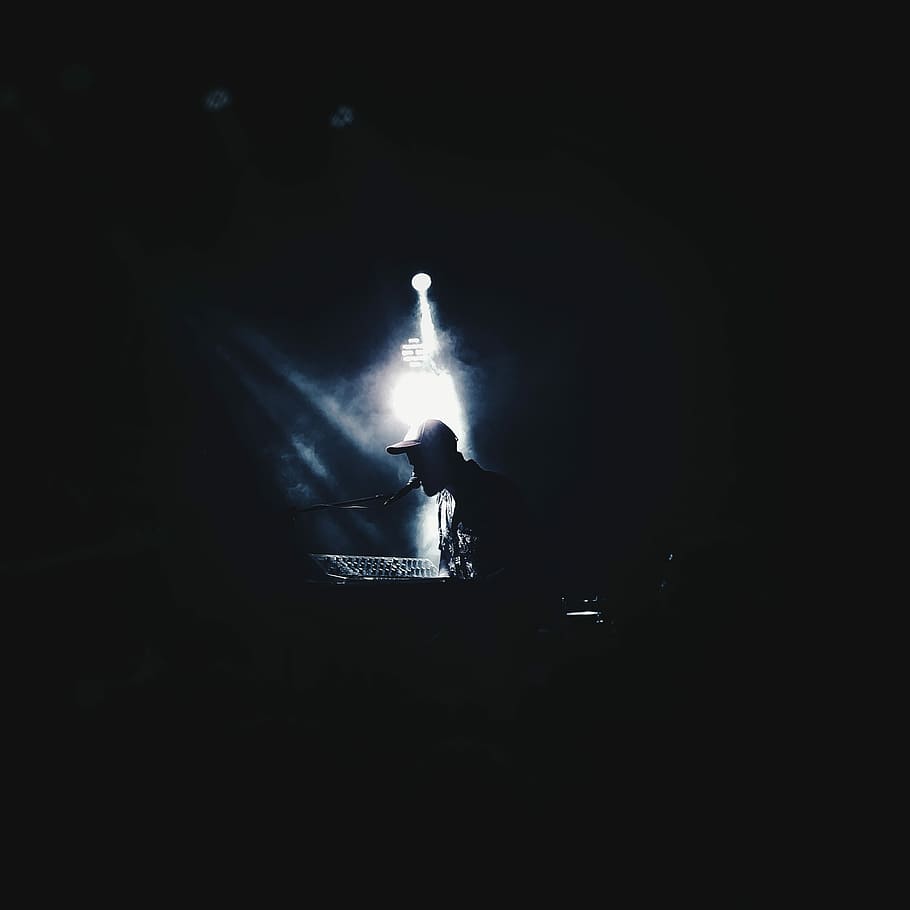 photograph of person wearing cap using microphone and DJ controller, man singing with spot light HD wallpaper
