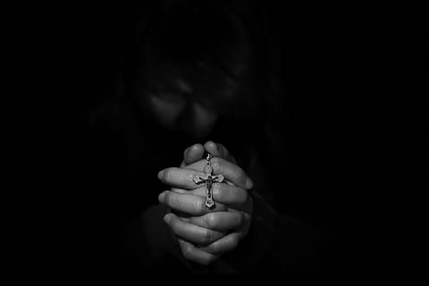 closeup grayscale photography of person's hand holding rosary HD wallpaper