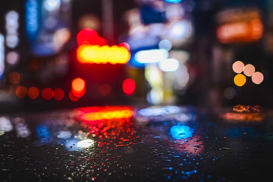 selective focus photography of water droplet on black surface, bokeh lights HD wallpaper