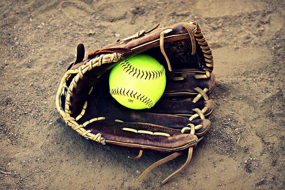 baseball game ball in baseball mitt, softball, outside, leather