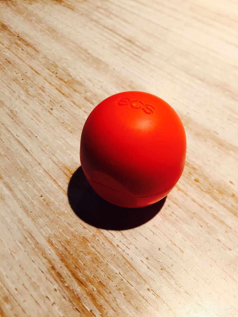 eos, lip balm, red, table, wood - material, still life, indoors HD wallpaper