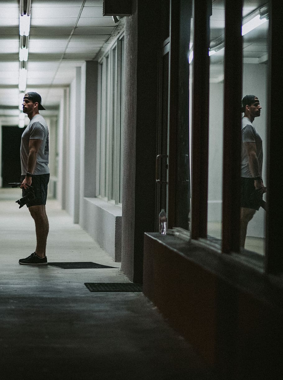 man standing near glass door, person, profile, night, thoughtful HD wallpaper