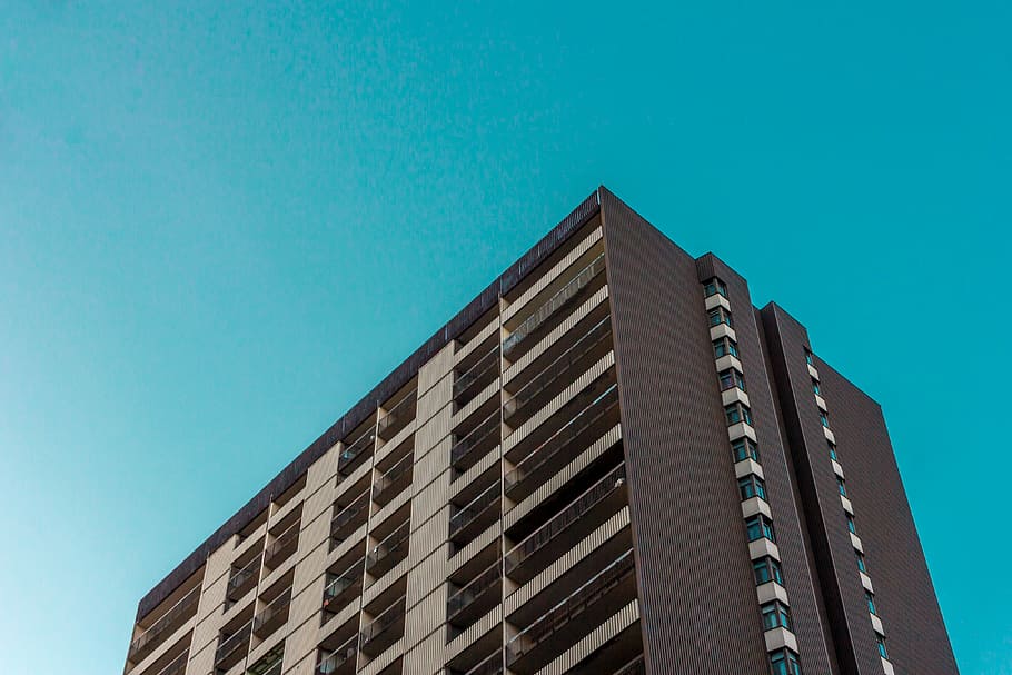 brown concrete building during daytime, low-angle photo of brown concrete builing HD wallpaper