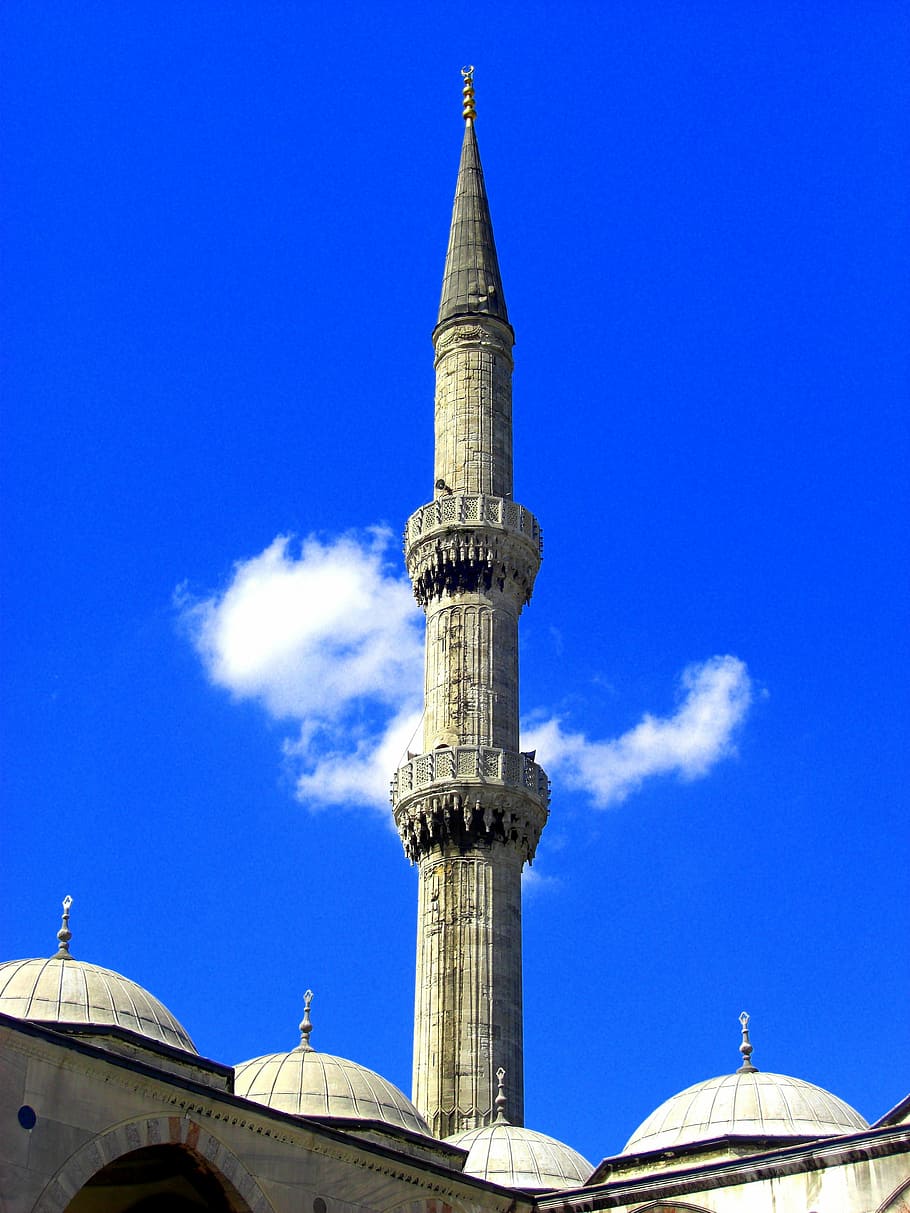 grey concrete tower under cloudy sky, blue, minaret, mosque, islam