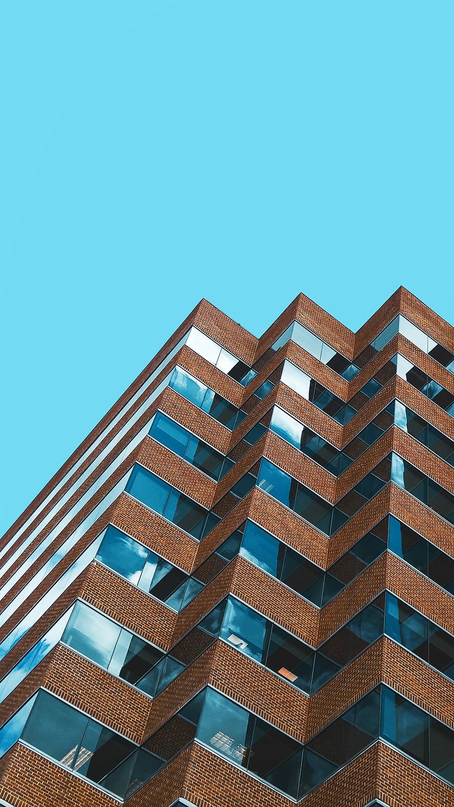 Symmetry, brown concrete building during daytime, brick, windows HD wallpaper