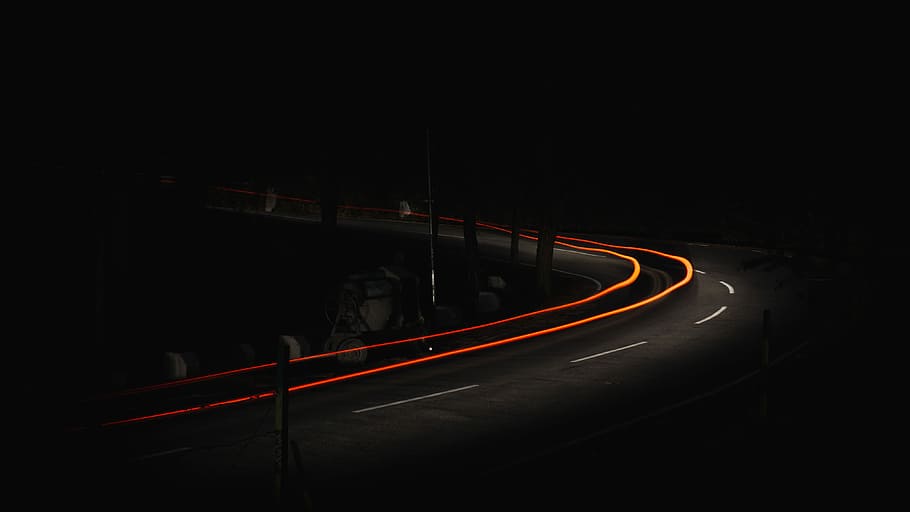 time lapse photo of car on road, time-lapse photography of vehicle on winding road