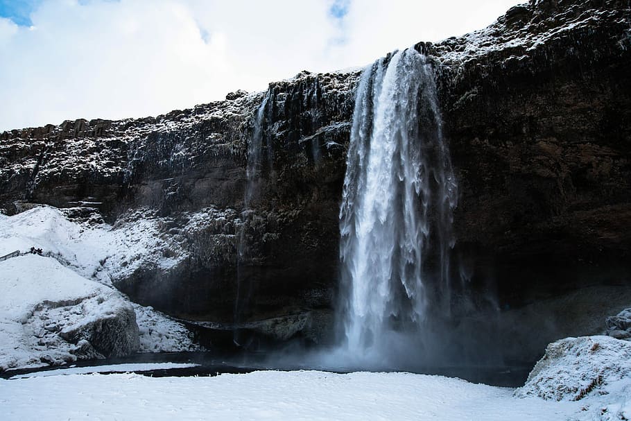 low angle photography of snow-covered waterfalls, waterfalls near snow field during daytime HD wallpaper