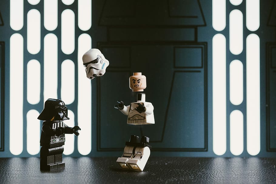 Darth Vader Lego figure beside Stormtrooper, Star Wars Darth Vader and StormTrooper plastic toys