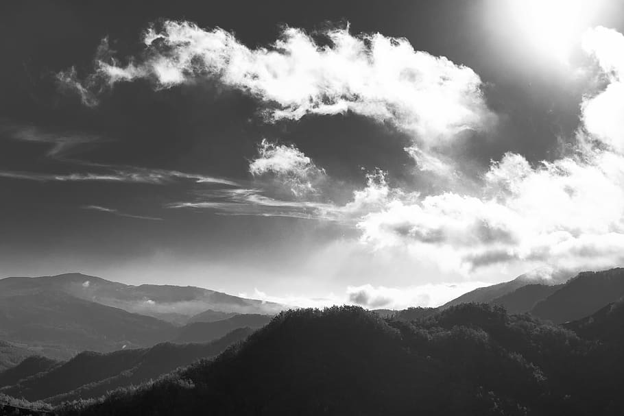 grayscale photography of mountain, sky and mountains during day HD wallpaper