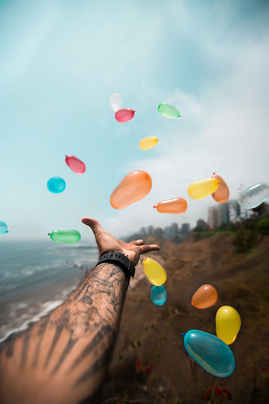 person throwing balloons, person reaching balloons, hand, human hand HD wallpaper