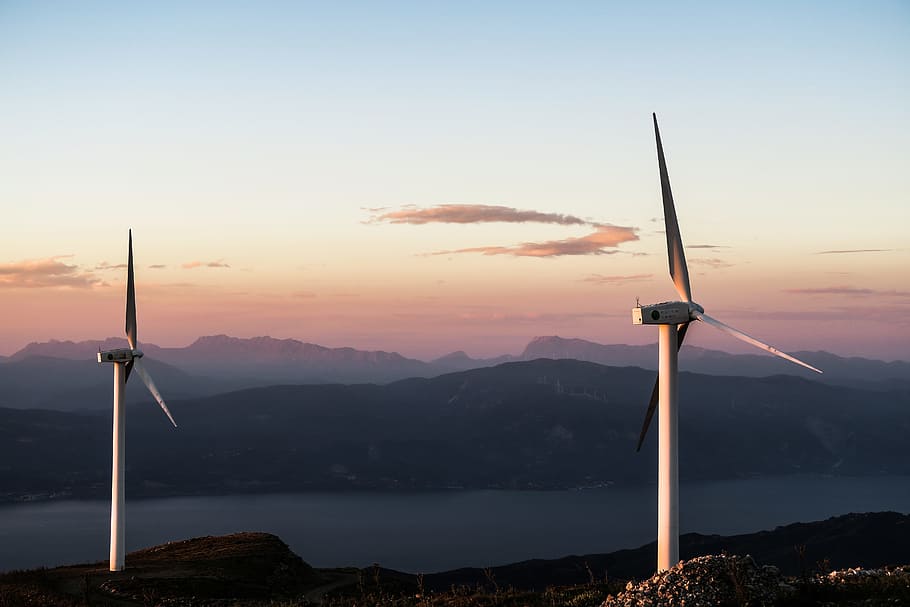 two white wind turbines, two white windmills during sunset photo HD wallpaper