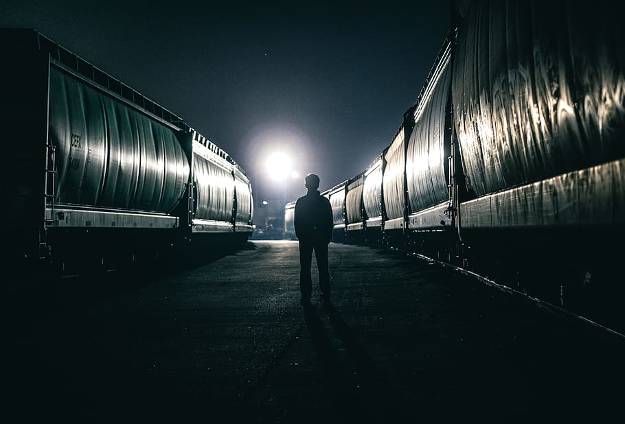 silhouette of man standing beside train, man standing near train HD wallpaper