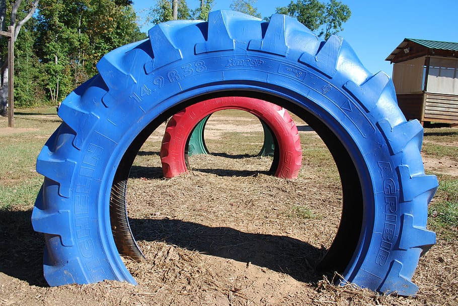 tires, playground, circle, toys, architecture, day, nature HD wallpaper