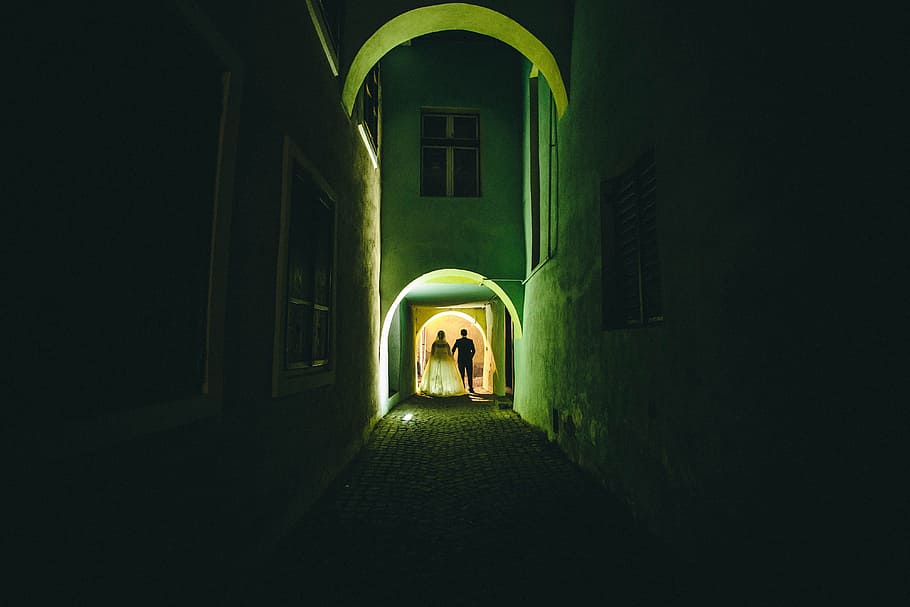 dark, building, infrastructure, wall, light, people, woman HD wallpaper