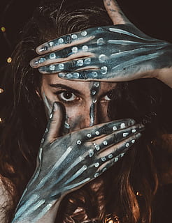 woman with black and white body paint covering half of her face with her hands, woman covering her face HD wallpaper